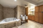 Jacuzzi hot tub with led light, shower, towel rack, custome cabinets, vanity, custom door